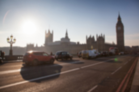 blurred background of traffic on Westminster Bridge with typical English cabs and busesの写真素材