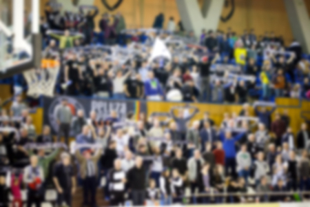blurred background of crowd of people in a basketball courtの写真素材
