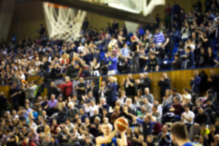 blurred background of crowd of people in a basketball court