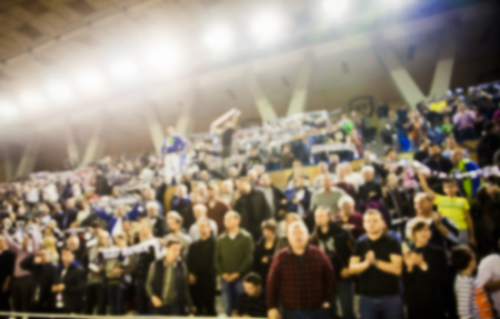 blurred background of crowd of people in a basketball courtの写真素材