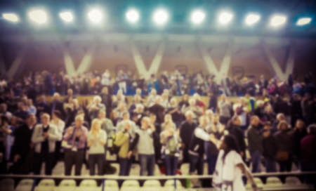 blurred background of crowd of people in a basketball courtの写真素材