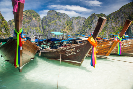 KO PHI PHI, THAILAND, February 1, 2014: Traditional long tail boats on the beach of Maya Bay, Ko Phi Phi Leh, Andaman Sea, famous tourist destination in the Ko Phi Phi achipelagoのeditorial素材