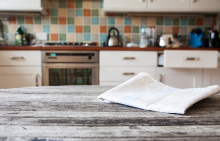 blurred kitchen interior and napkin and desk spaceの写真素材