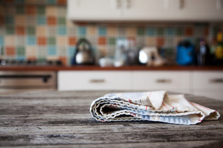 blurred kitchen interior and napkin and desk spaceの写真素材