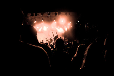 crowd with raised hands at concert - summer music festival
