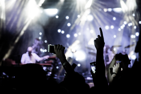 crowd with raised hands at concert - summer music festivalのeditorial素材