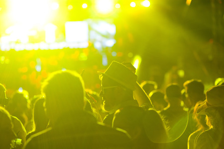 crowd with raised hands at concert - summer music festivalの写真素材