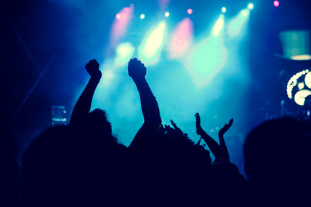 crowd with raised hands at concert - summer music festivalの写真素材