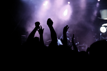 crowd with raised hands at concert - summer music festivalの写真素材