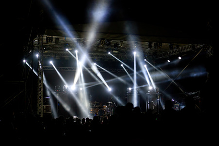 crowd with raised hands at concert - summer music festivalの写真素材