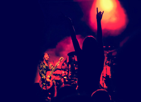 crowd with raised hands at concert - summer music festival