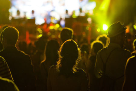 crowd with raised hands at concert - summer music festivalの写真素材