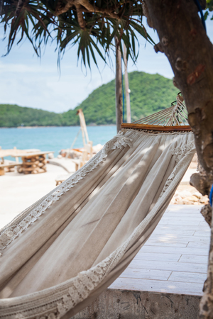 hammock by the sea on tropical islandの写真素材