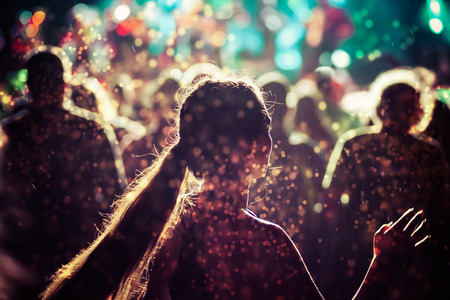 crowd with raised hands at concert - summer music festivalの写真素材