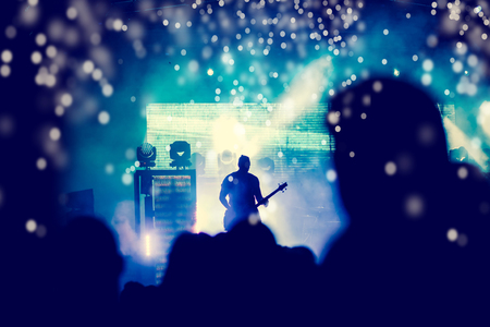 crowd with raised hands at concert - summer music festival