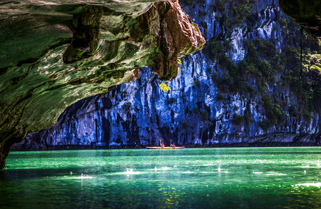 kayaking among caves and lagoon in Ha Long bay, Vietnam.の写真素材