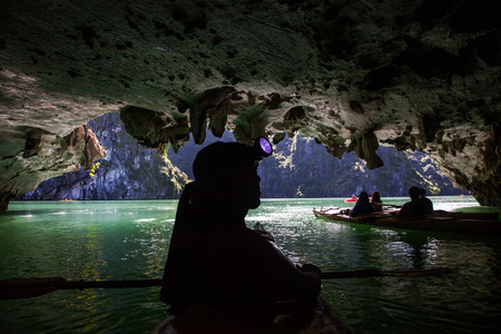 kayaking among caves and lagoon in Ha Long bay, Vietnamの写真素材