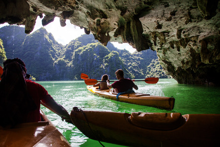 kayaking among caves and lagoon in Ha Long bay, UNESCO world heritage site, Vietnamのeditorial素材