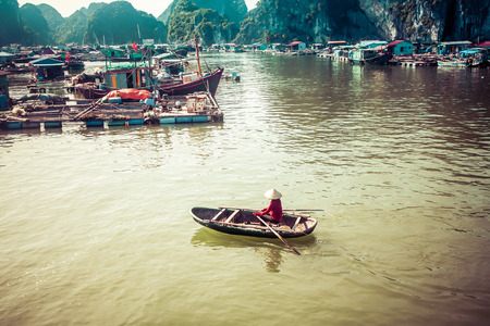 traditonal vietnamese boats and floating village near Cat Ba island, Lan Ha bay, the southestern part of Ha Lng Bay, Vietnamのeditorial素材