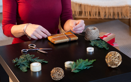 woman wrapping christmas presentsの写真素材