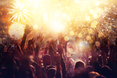 cheering crowd watching fireworks - new year conceptの写真素材