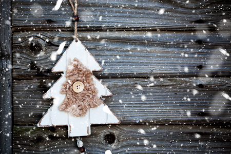 vintage wooden christmas decoration hanging - rustic holiday backgroundの写真素材