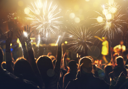 new Year concept - cheering crowd and fireworksの写真素材