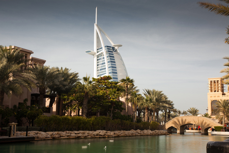DUBAI, UAE - FEBRUARY, 2018: View on Burj Al Arab, the world only seven stars hotel seen from Madinat Jumeirah, a luxury resort which include hotels and souk spreding across over 40 hectars.のeditorial素材
