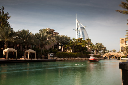 DUBAI, UAE - FEBRUARY, 2018: View on Burj Al Arab, the world only seven stars hotel seen from Madinat Jumeirah, a luxury resort which include hotels and souk spreding across over 40 hectars.のeditorial素材
