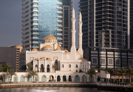 DUBAI, UAE - FEBRUARY 2018: View of modern skyscrapers shining in sunrise lights  in Dubai Marina in Dubai, UAE.のeditorial素材