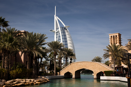 DUBAI, UAE - FEBRUARY, 2018: View on Burj Al Arab, the world only seven stars hotel seen from Madinat Jumeirah, a luxury resort which include hotels and souk spreding across over 40 hectars.のeditorial素材