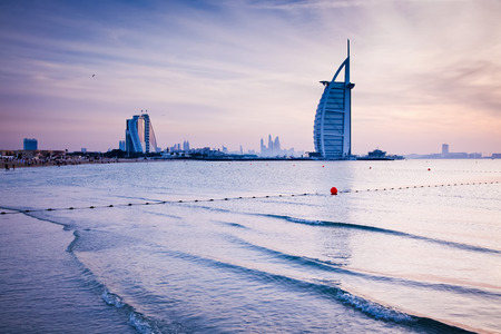 DUBAI, UAE - FEBRUARY 2018 :The world's first seven stars luxury hotel Burj Al Arab at sunset seen from Jumeirah public beach in Dubai, United Arab Emiratesのeditorial素材