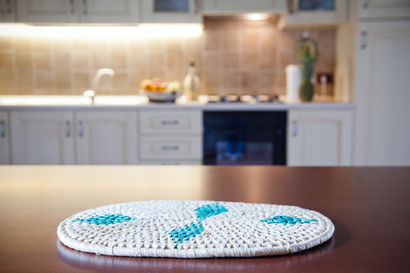 blurred kitchen interior and napkin and desk spaceの写真素材