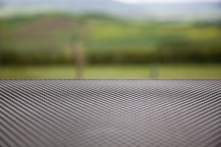 empty tabletop outdoors againt beautiful green landscape in Tuscany