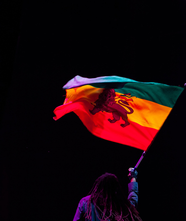 black man waving jamaica flagの写真素材