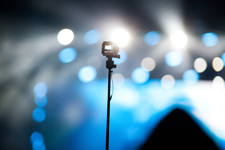 cheering crowd with raised hands at concert - music festival