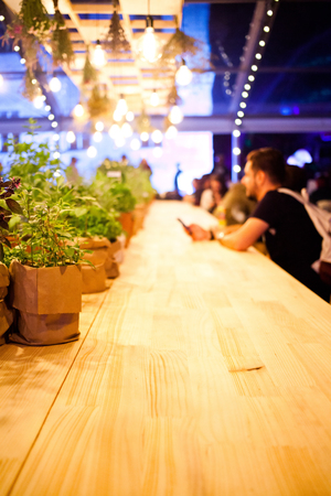 people sitting at a bar - focus on tableの写真素材