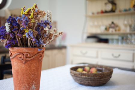 basket with peaches on retro kitchen tableの写真素材