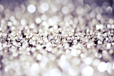 abstract Christmas background with holiday lights and copy space - magic bokeh glitter with blinking stars and falling snowflakesの写真素材