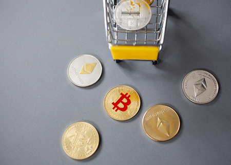 cryptocurrencies and shopping cart -  bitcoin, litecoin, ethereumの写真素材