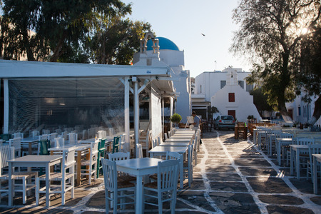 traditional narrow street in Mykonos with blue doors and white wallsのeditorial素材