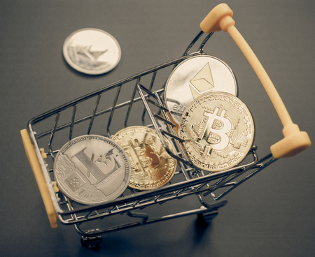 cryptocurrencies and shopping cart -  bitcoin, litecoin, ethereumの写真素材