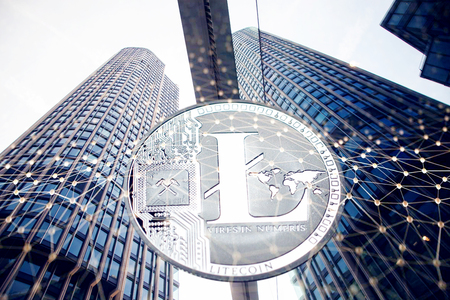 litecoin against skyscrapers - futuristic smart city - cryptocurrency conceptの写真素材