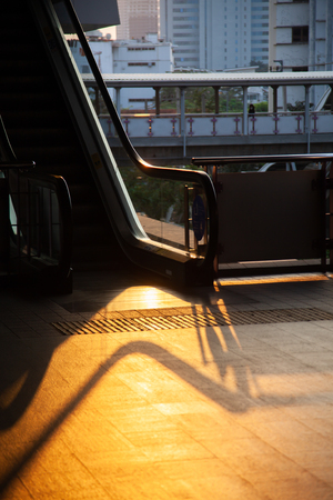 commuter silhouettes in a station in early morningの写真素材