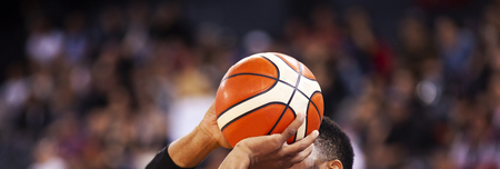 basketball player shooting three pointer during gameの写真素材