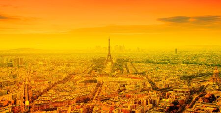 eiffel tower and bright sun on orange - heat wave in Paris, Franceの写真素材