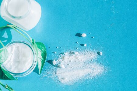 skin care with natural products baking soda,  coconut oil - top view on bright blue backgroundの写真素材