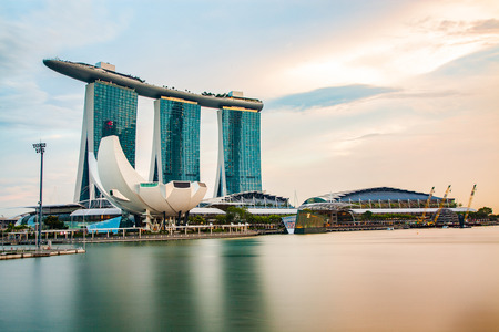 SINGAPORE, SINGAPORE - MARCH 2019: Skyline of Singapore Marina Bay at night with Marina Bay sands, Art Science museum and tourist boatsのeditorial素材