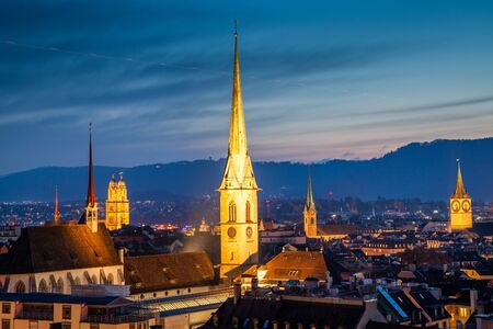 zurich skyline with church steeples at night Switzerland
