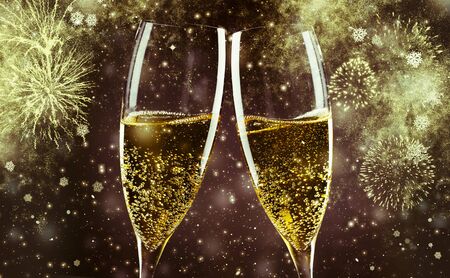 two champagne glasses ready to bring in the New Yearの写真素材
